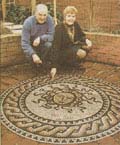 [the newspaper's picture of us with the mosaic!]